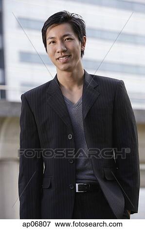 Stock Photo - Businessman looking at camera. Fotosearch