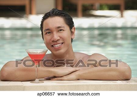 Man in swimming pool, leaning on the edge View Large Photo Image Stock Photo - Man in swimming pool, leaning on the edge. Fotosearch