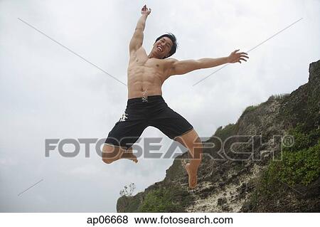 Man jumping in air View Large Photo Image Stock Photo - Man jumping in air. Fotosearch