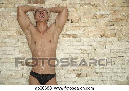 Muscular man bathing View Large Photo Image Stock Image - Muscular man bathing. Fotosearch