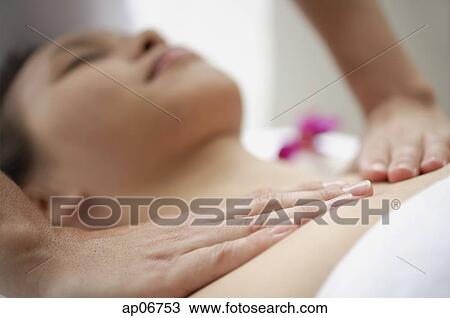 Young woman getting a massage, close up on masseuses hands View Large Photo Image Stock Image - Young woman getting a massage, close up on masseuses hands. Fotosearch