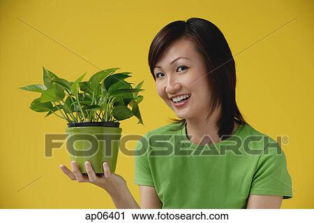 Young Woman looking at camera, sideview View Large Photo Image Stock Image - Young Woman looking at camera, sideview. Fotosearch