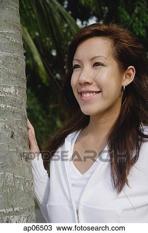 Young woman looking away View Large Photo Image Stock Image - Young woman looking away. Fotosearch