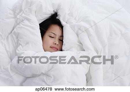 Young woman sleeping, covered by blanket View Large Photo Image Stock Photo - Young woman sleeping, covered by blanket. Fotosearch