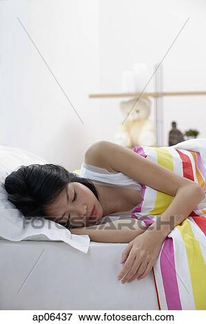 Young woman sleeping View Large Photo Image Stock Photo - Young woman sleeping. Fotosearch