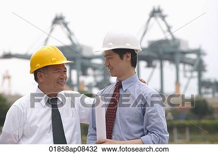 Men with helmets looking at each other View Large Photo Image Stock Photo - Men with helmets looking at each other. Fotosearch - Search Stock Photography, Print Pictures, Images, and Photo Clip Art