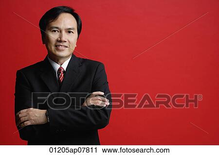 A businessman crosses his arms View Large Photo Image Stock Image - A businessman crosses his arms. Fotosearch