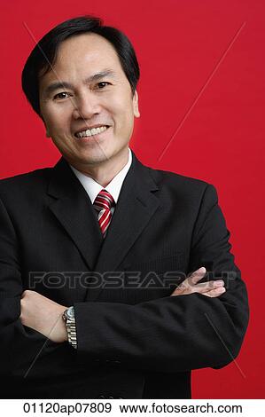 A businessman crosses his arms View Large Photo Image Stock Photo - A businessman crosses his arms. Fotosearch