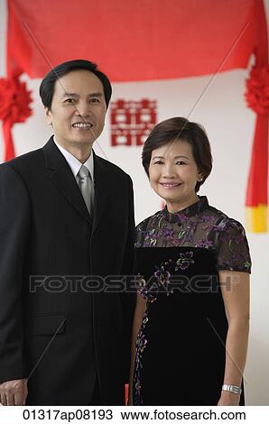 Stock Image - A couple smile at the camera. Fotosearch