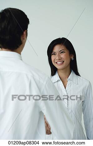 A man and a woman shake hands View Large Photo Image Picture - A man and a woman shake hands. Fotosearch