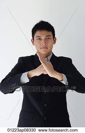 A man in a business suit makes a threatening gesture View Large Photo Image Stock Image - A man in a business suit makes a threatening gesture. Fotosearch