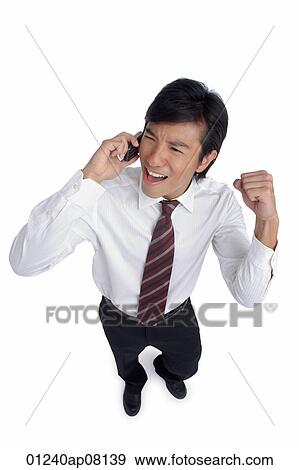 A man is excited as he talks on his cellphone View Large Photo Image Stock Photo - A man is excited as he talks on his cellphone. Fotosearch