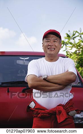 A man with a red van smiles at the camera as he works View Large Photo Image Stock Image - A man with a red van smiles at the camera as he works. Fotosearch