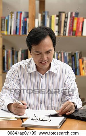 A man working View Large Photo Image Stock Photo - A man working. Fotosearch