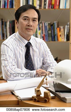 Stock Photograph - A man working. Fotosearch