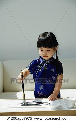 A small girl in blue silk cheongsam writing Chinese calligraphy View Large Photo Image Stock Photography - A small girl in blue silk cheongsam writing Chinese calligraphy. Fotosearch
