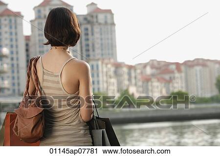 A woman with lots of shopping bags View Large Photo Image Stock Image - A woman with lots of shopping bags. Fotosearch