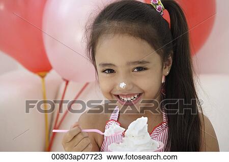 A young girl at a party with balloons View Large Photo Image Stock Image - A young girl at a party with balloons. Fotosearch