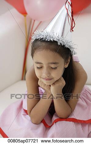 A young girl at a party with balloons View Large Photo Image Stock Image - A young girl at a party with balloons. Fotosearch