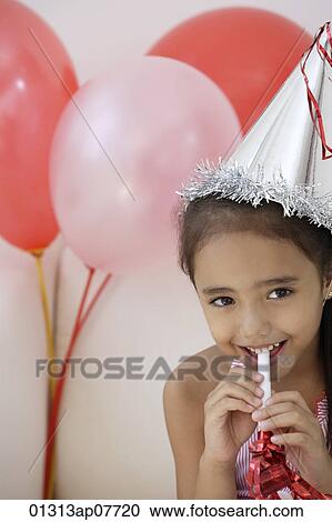 A young girl at a party with balloons View Large Photo Image Stock Image - A young girl at a party with balloons. Fotosearch