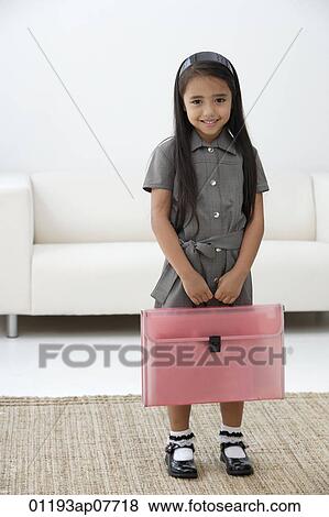 A young girl dressed in school uniform View Large Photo Image Stock Photo - A young girl dressed in school uniform. Fotosearch