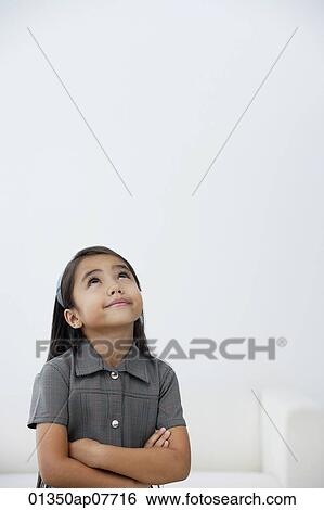 A young girl dressed in school uniform crosses her arms View Large Photo Image Stock Photograph - A young girl dressed in school uniform crosses her arms. Fotosearch
