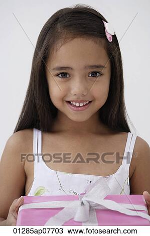 A young girl with a birthday present View Large Photo Image Stock Image - A young girl with a birthday present. Fotosearch