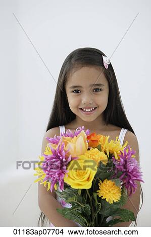 A young girl with a bunch of flowers View Large Photo Image Picture - A young girl with a bunch of flowers. Fotosearch