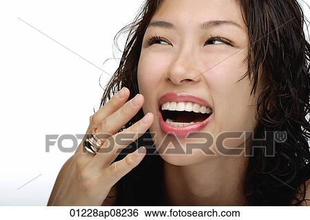 A young woman laughs View Large Photo Image Stock Photograph - A young woman laughs. Fotosearch