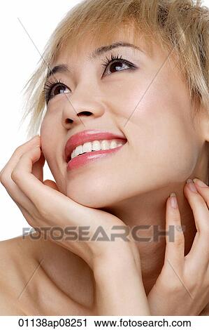 A young woman with dyed blonde hair smiles View Large Photo Image Stock Image - A young woman with dyed blonde hair smiles. Fotosearch