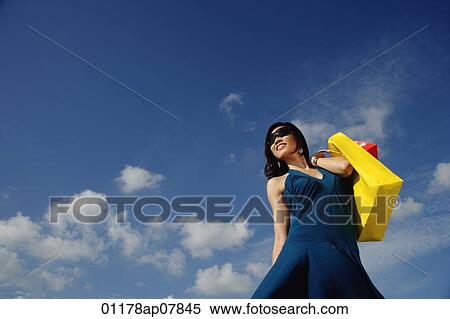 A young woman with shopping bags View Large Photo Image Stock Photography - A young woman with shopping bags. Fotosearch