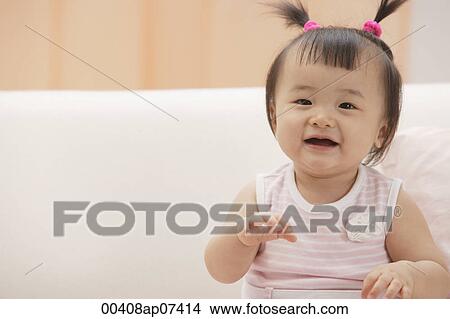 Baby girl laughing and smiling at camera View Large Photo Image Picture - Baby girl laughing and smiling at camera. Fotosearch