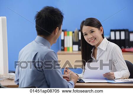 Businessman and woman looking at each other View Large Photo Image Stock Photography - Businessman and woman looking at each other. Fotosearch