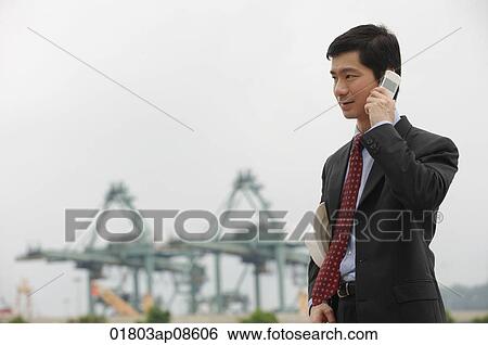 Stock Photograph - Businessman talking on the phone. Fotosearch