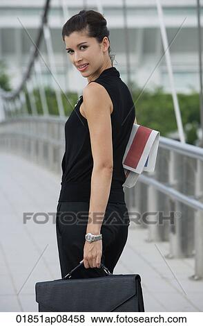 Businesswoman looking at camera View Large Photo Image Stock Photo - Businesswoman looking at camera. Fotosearch