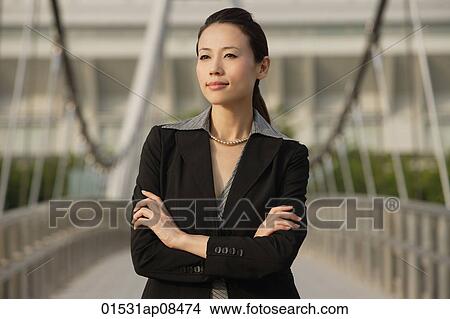 Businesswoman looking into distance View Large Photo Image Picture - Businesswoman looking into distance. Fotosearch