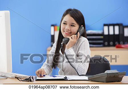 Businesswoman talking on the phone View Large Photo Image Stock Photo - Businesswoman talking on the phone. Fotosearch