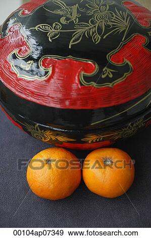 Chinese wedding basket with Mandarin Oranges, high angle view View Large Photo Image Stock Photo - Chinese wedding basket with Mandarin Oranges, high angle view. Fotosearch
