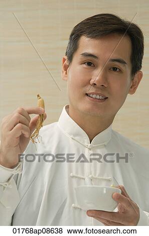Doctor experimenting with traditional Chinese medicine View Large Photo Image Stock Photo - Doctor experimenting with traditional Chinese medicine. Fotosearch