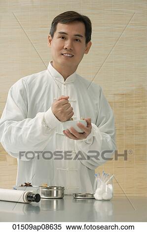 Doctor experimenting with traditional Chinese medicine View Large Photo Image Stock Photography - Doctor experimenting with traditional Chinese medicine. Fotosearch