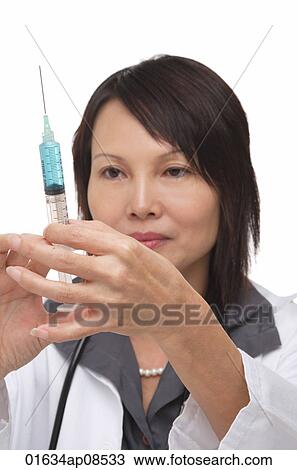 Doctor with syringe View Large Photo Image Stock Image - Doctor with syringe. Fotosearch