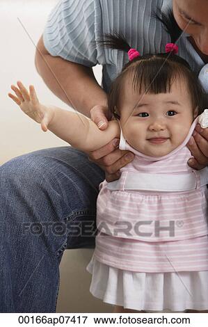 father and baby girl, father holding girl under arms View Large Photo Image Stock Photo - father and baby girl, father holding girl under arms. Fotosearch