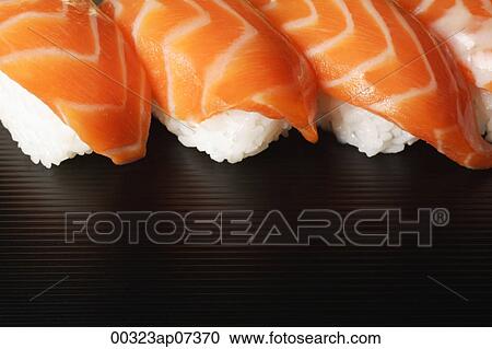 Four pieces of Salmon Sushi, nigiri on rice ball View Large Photo Image Stock Image - Four pieces of Salmon Sushi, nigiri on rice ball. Fotosearch