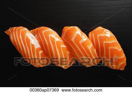 Stock Photo - Four pieces of Salmon Sushi, nigiri on rice ball. Fotosearch