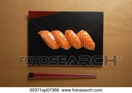 Four pieces of Salmon Sushi, nigiri on rice ball, chopsticks View Large Photo Image Stock Photo - Four pieces of Salmon Sushi, nigiri on rice ball, chopsticks. Fotosearch