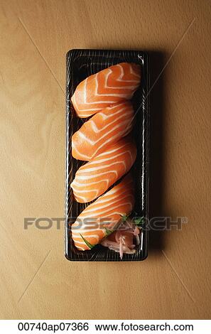 Four pieces of Salmon Sushi, nigiri on rice ball View Large Photo Image Stock Photograph - Four pieces of Salmon Sushi, nigiri on rice ball. Fotosearch