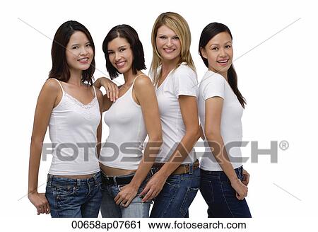 Four young women wearing white shirts and jeans, smiling at camera View Large Photo Image Stock Image - Four young women wearing white shirts and jeans, smiling at camera. Fotosearch