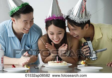 Friends celebrating birthday View Large Photo Image Stock Image - Friends celebrating birthday. Fotosearch