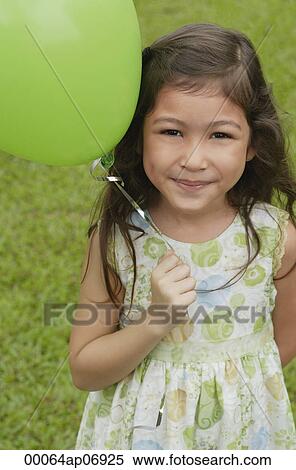 Girl with green balloon, portrait View Large Photo Image Stock Photography - Girl with green balloon, portrait. Fotosearch