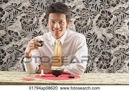 Man having meal at restaurant View Large Photo Image Stock Image - Man having meal at restaurant. Fotosearch